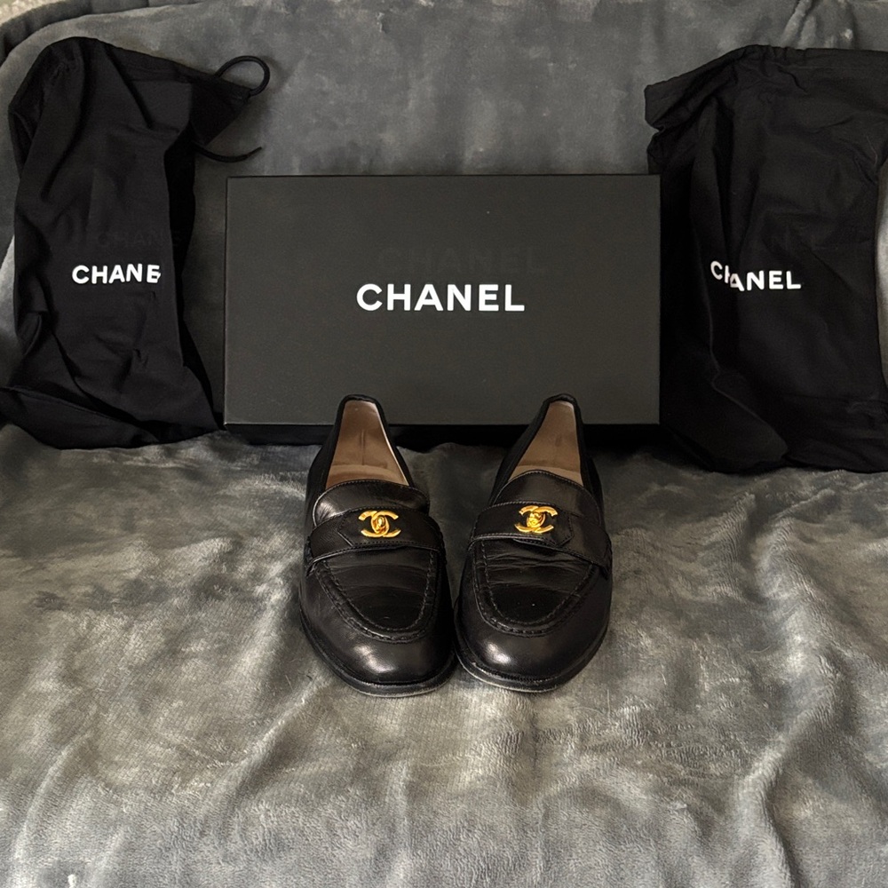 CHANEL Black Flats with Gold Emblem